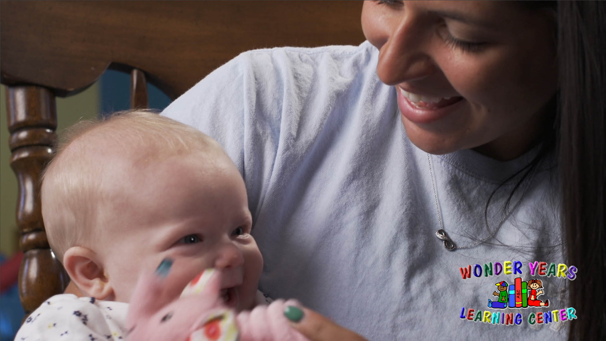 Teacher and infant at Wonder Years Learning Center.